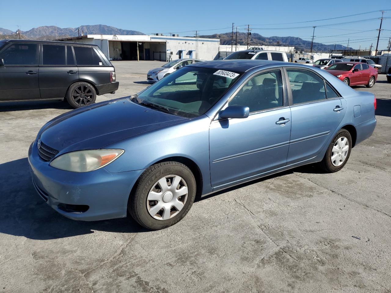 Obraz 1 z 2002 TOYOTA CAMRY LE 2002 z VIN JTDBE30K520061022