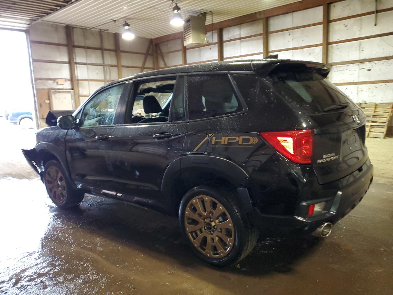 Изображение 2 2022 HONDA PASSPORT EXL 2022 с VIN 5FNYF8H59NB019994