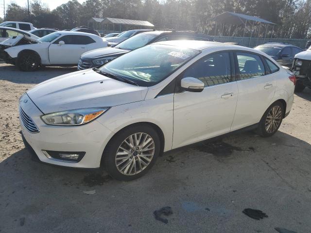 Image 1 of 2016 FORD FOCUS TITANIUM 2016 with VIN 1FADP3J21GL327696