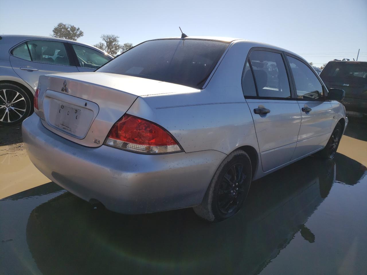 Obraz 3 z 2004 MITSUBISHI LANCER ES 2004 z VIN JA3AJ26E84U036435