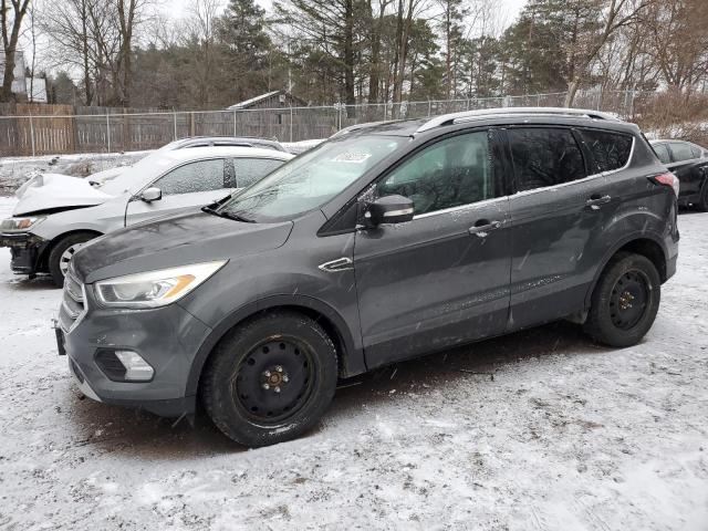 Obraz 1 z 2017 FORD ESCAPE TITANIUM 2017 z VIN 1FMCU9J91HUD87743