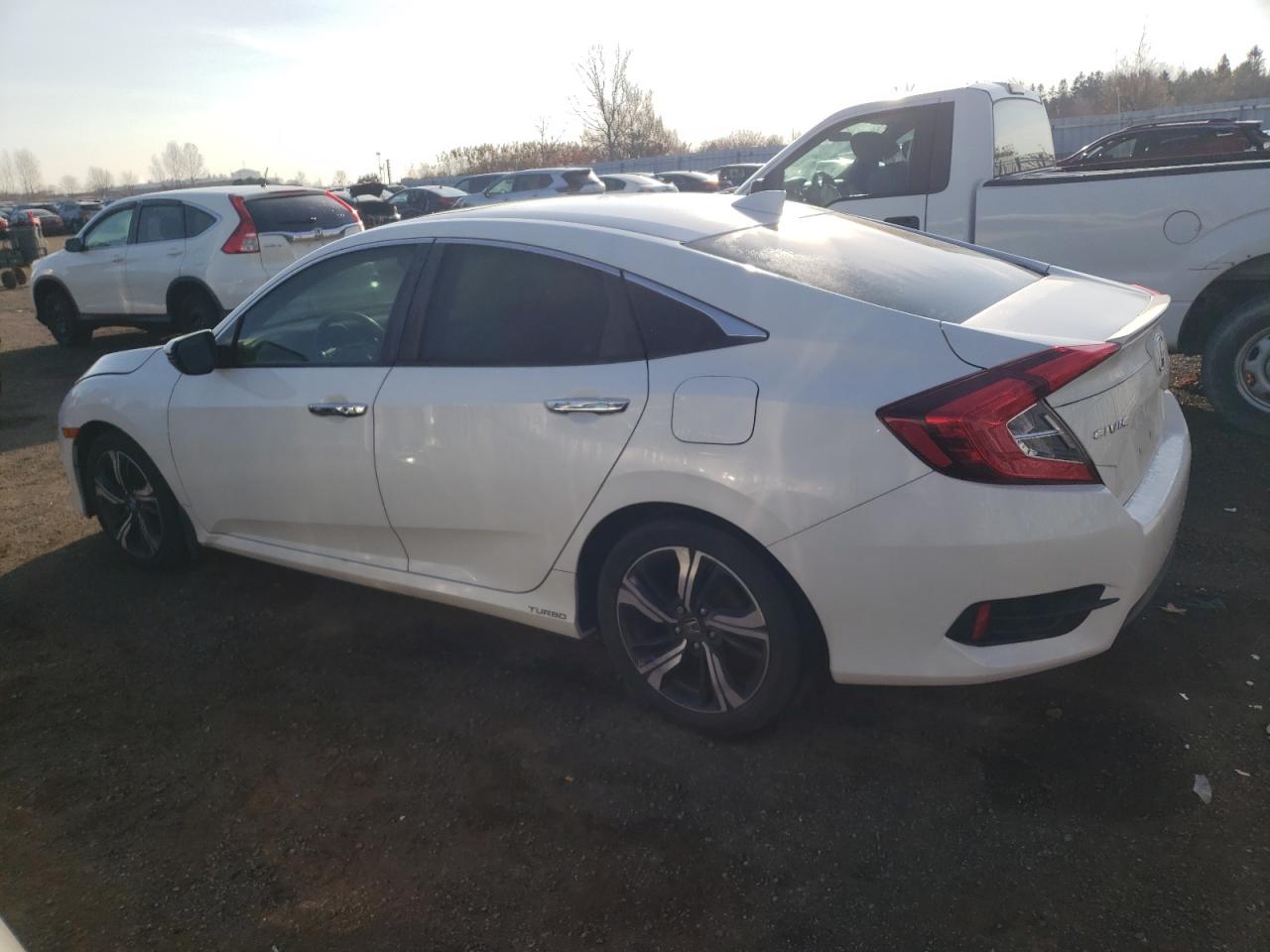 Image 2 of Honda Civic Touring 2016 with VIN 2HGFC1F99GH101011