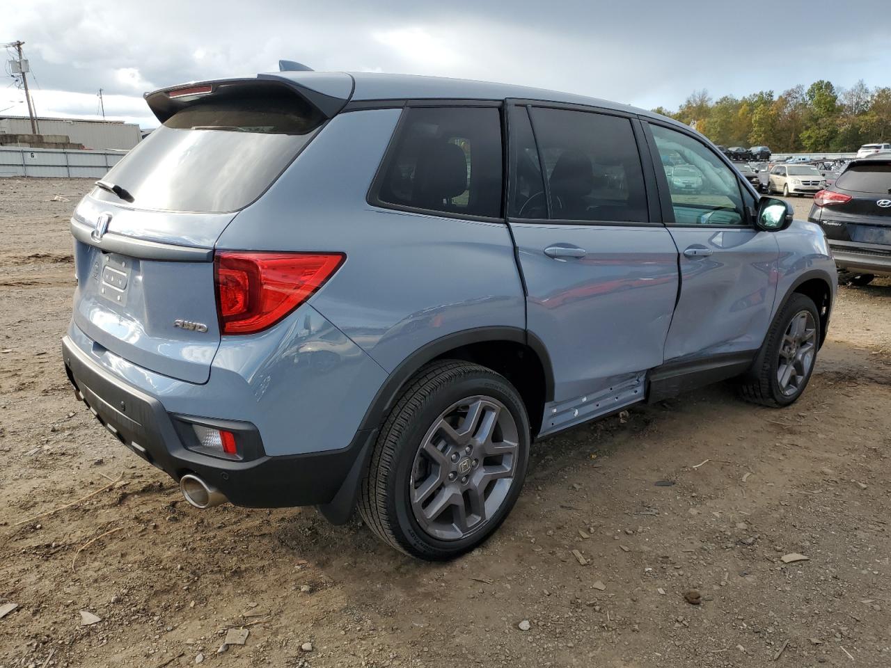 Изображение 3 2022 HONDA PASSPORT EXL 2022 с VIN 5FNYF8H56NB012954