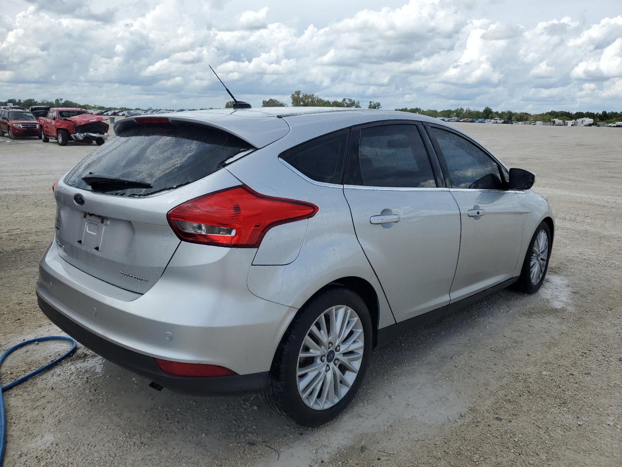 Image 3 of 2015 FORD FOCUS TITANIUM 2015 with VIN 1FADP3N25FL229120