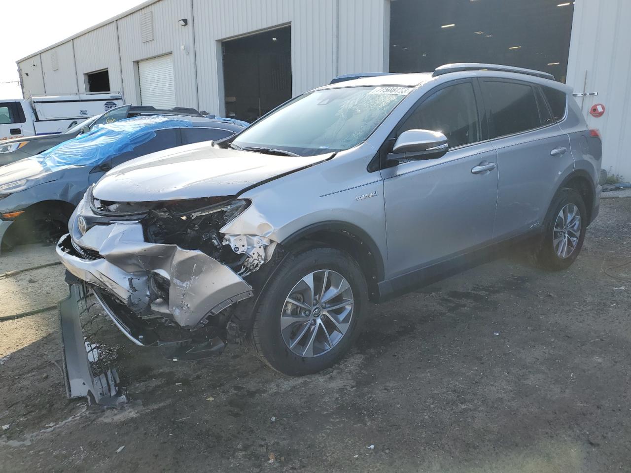 Image 1 of 2018 TOYOTA RAV4 HV LE 2018 with VIN JTMRJREV2JD253747