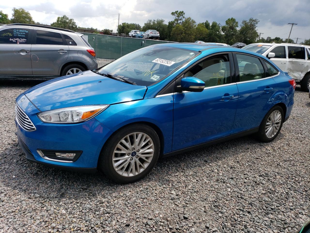 Image 1 of 2017 FORD FOCUS TITANIUM 2017 with VIN 1FADP3J27HL212960