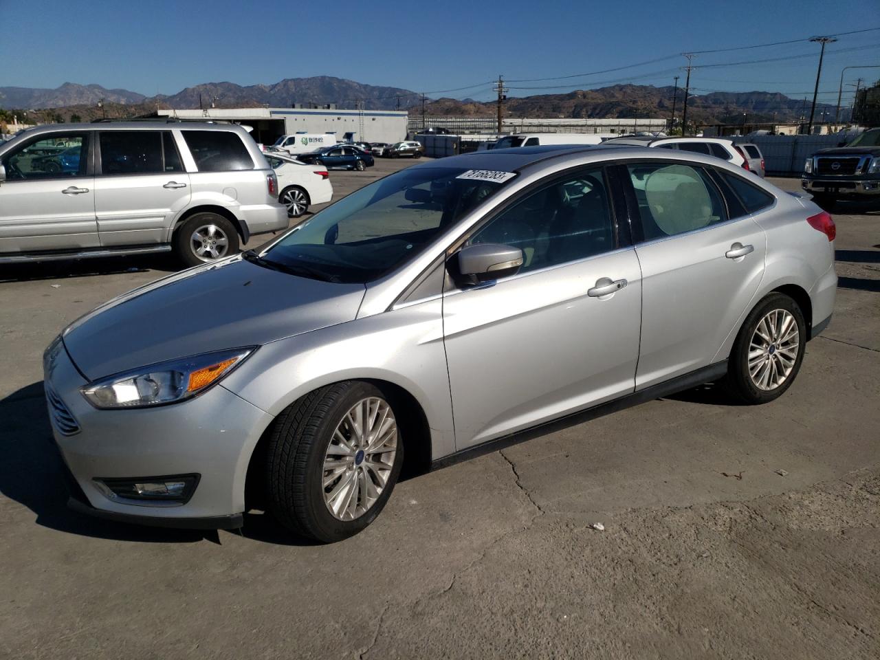 Image 1 of 2018 FORD FOCUS TITANIUM 2018 with VIN 1FADP3J24JL314318