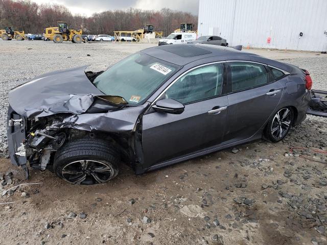 Obraz 1 z 2016 HONDA CIVIC TOURING 2016 z VIN 2HGFC1F97GH630702