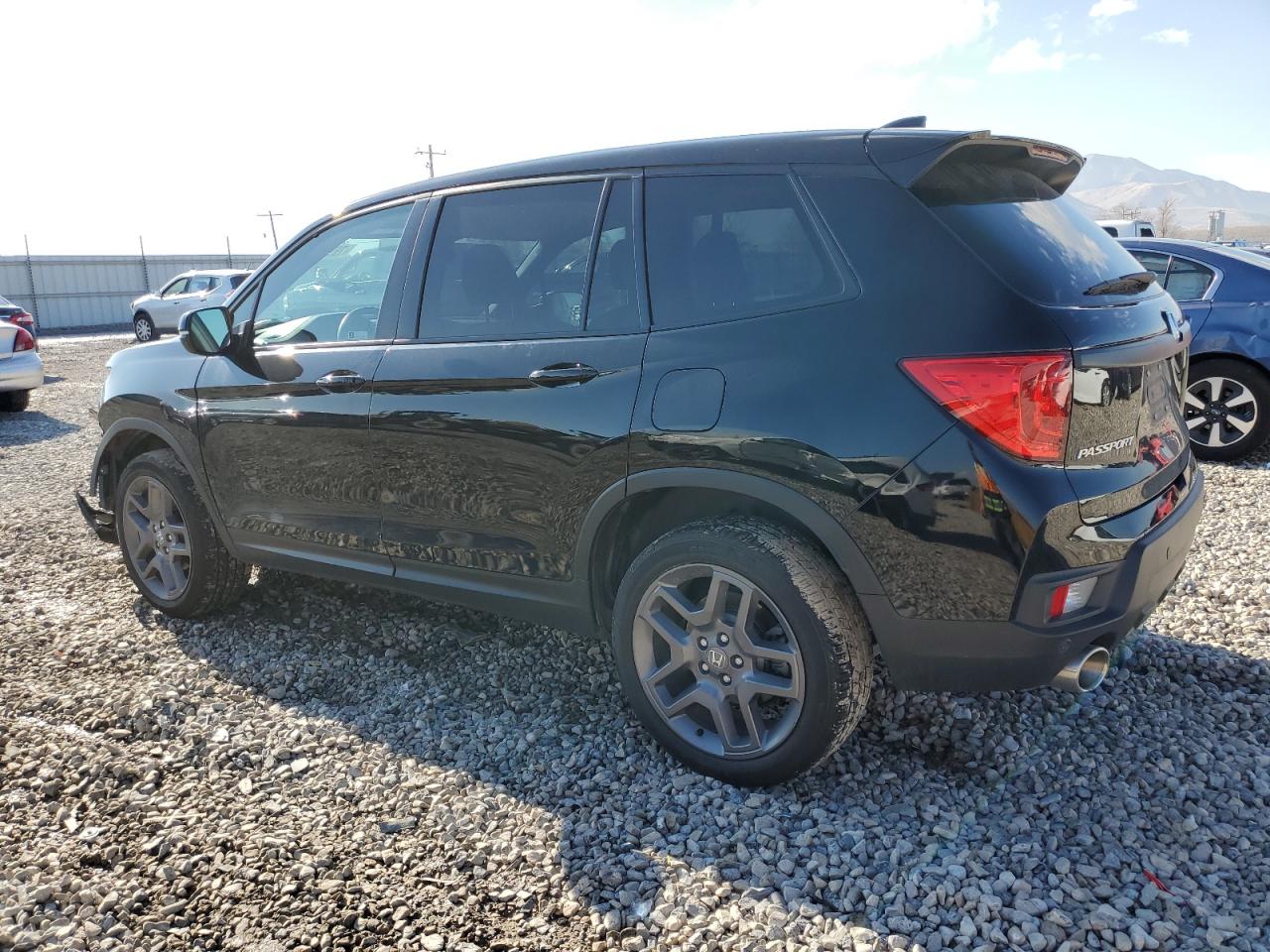 Изображение 2 2022 HONDA PASSPORT EXL 2022 с VIN 5FNYF8H52NB030478