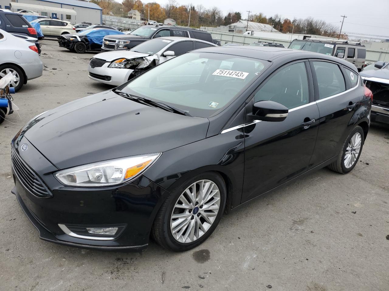 Image 1 of 2017 FORD FOCUS TITANIUM 2017 with VIN 1FADP3N23HL333771