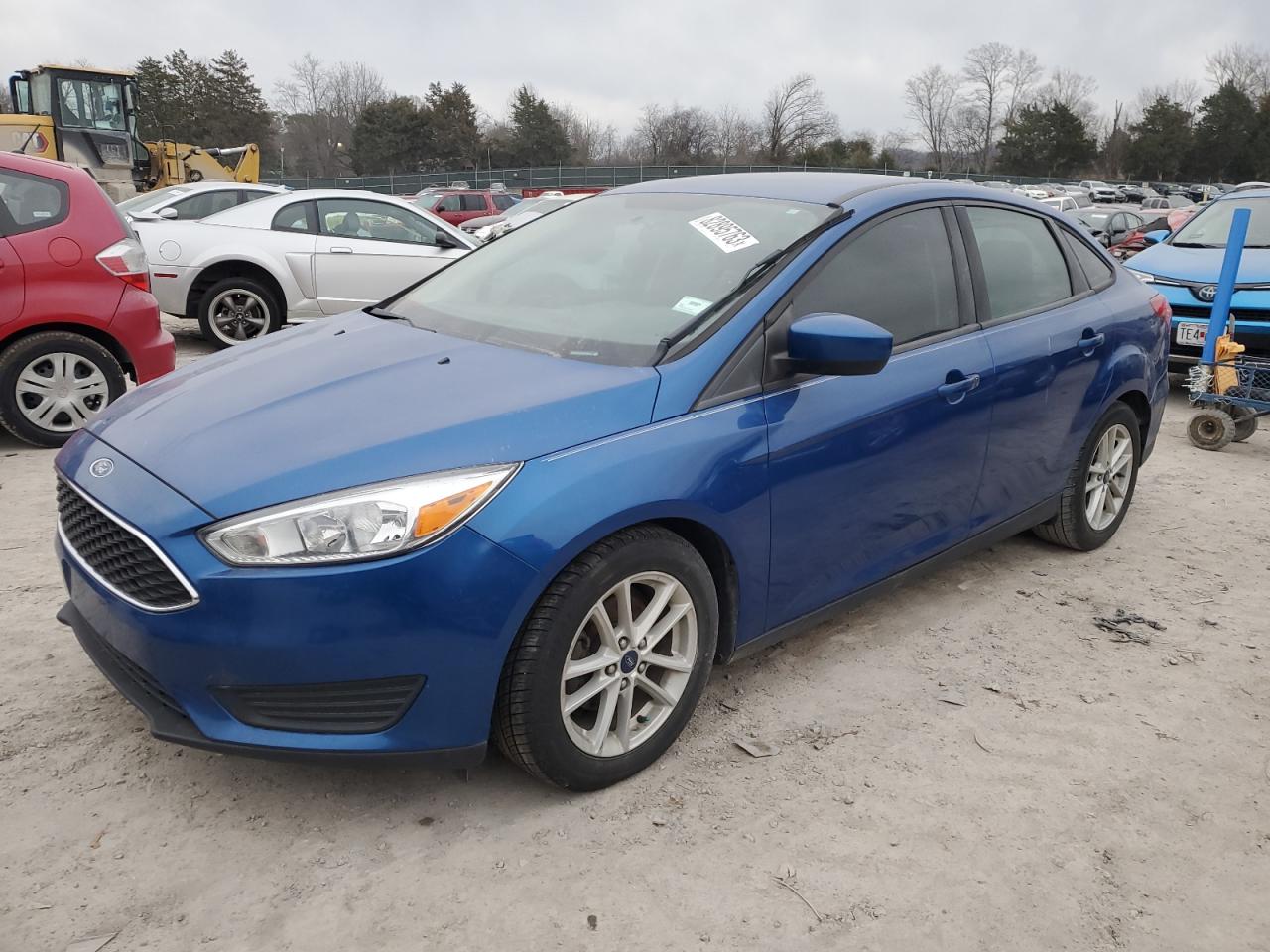 Image 1 of 2018 FORD FOCUS SE 2018 with VIN 1FADP3FEXJL275611