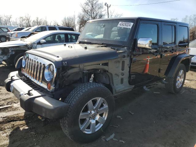 Image 1 of 2012 JEEP WRANGLER UNLIMITED SAHARA 2012 with VIN 1C4HJWEG8CL123248
