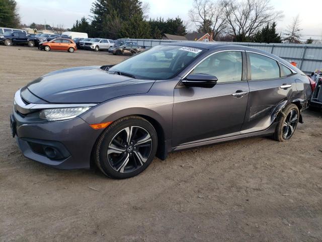 Obraz 1 z 2017 HONDA CIVIC TOURING 2017 z VIN 2HGFC1F97HH655262