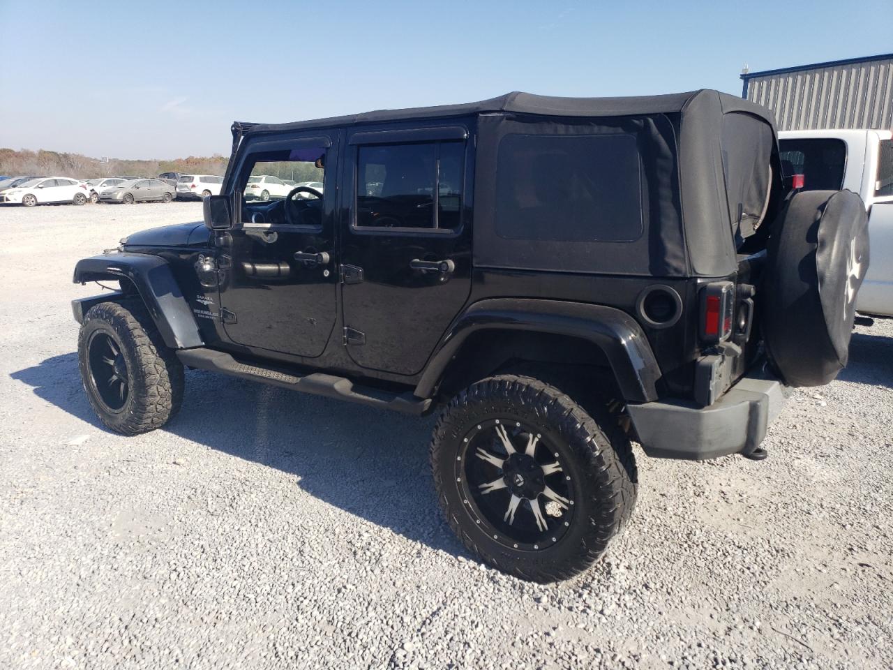Изображение 2 Jeep Wrangler Unlimited Sahara 2009 с VIN 1J8GA59189L739402