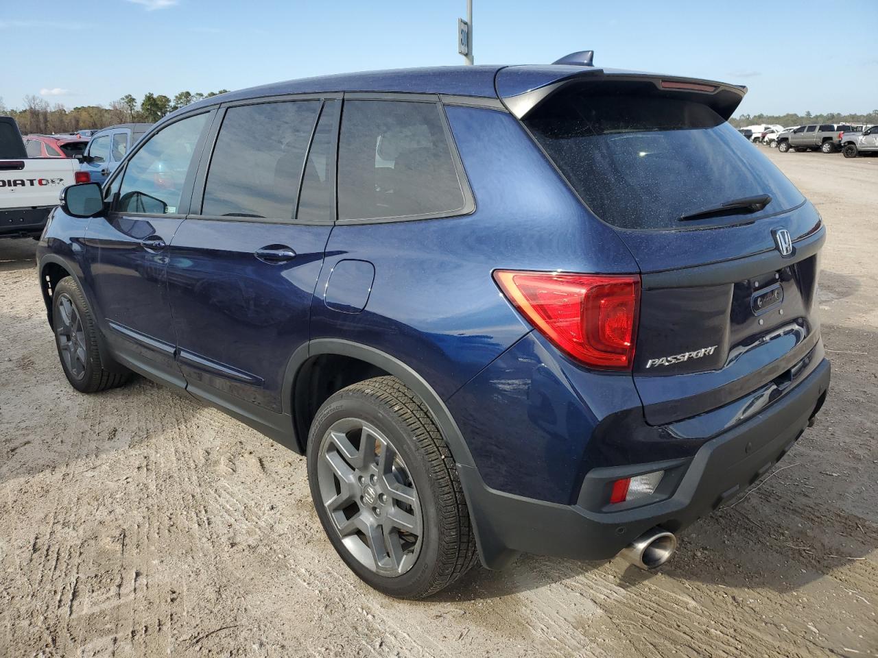 Изображение 2 2023 HONDA PASSPORT EXL 2023 с VIN 5FNYF8H50PB004917