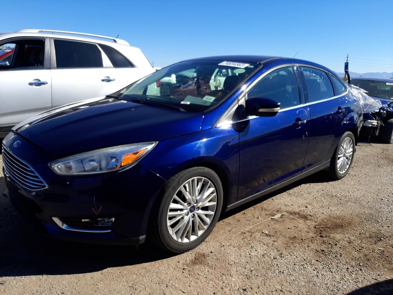 Image 1 of 2017 FORD FOCUS TITANIUM 2017 with VIN 1FADP3J22HL202000