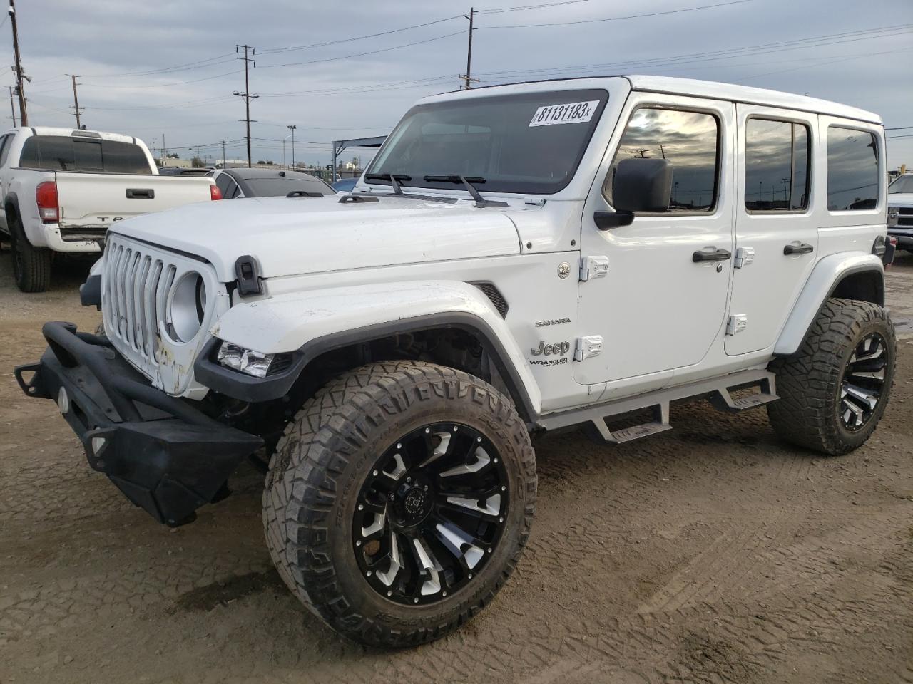 Image 1 of 2019 JEEP WRANGLER UNLIMITED SAHARA 2019 with VIN 1C4HJXEN7KW614637