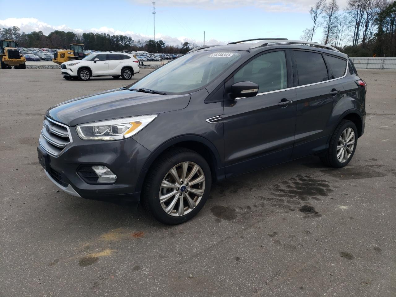 Image 1 of 2017 FORD ESCAPE TITANIUM 2017 with VIN 1FMCU9J94HUF09138