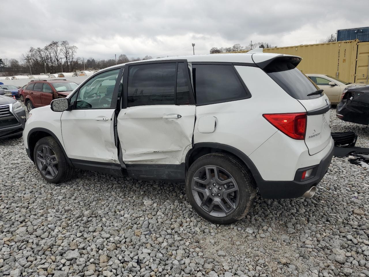 Изображение 2 2023 HONDA PASSPORT EXL 2023 с VIN 5FNYF8H57PB038885